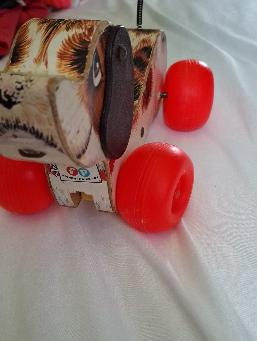 Fisher-Price Wooden Pull Dog Toy with Bright Red Wheels
